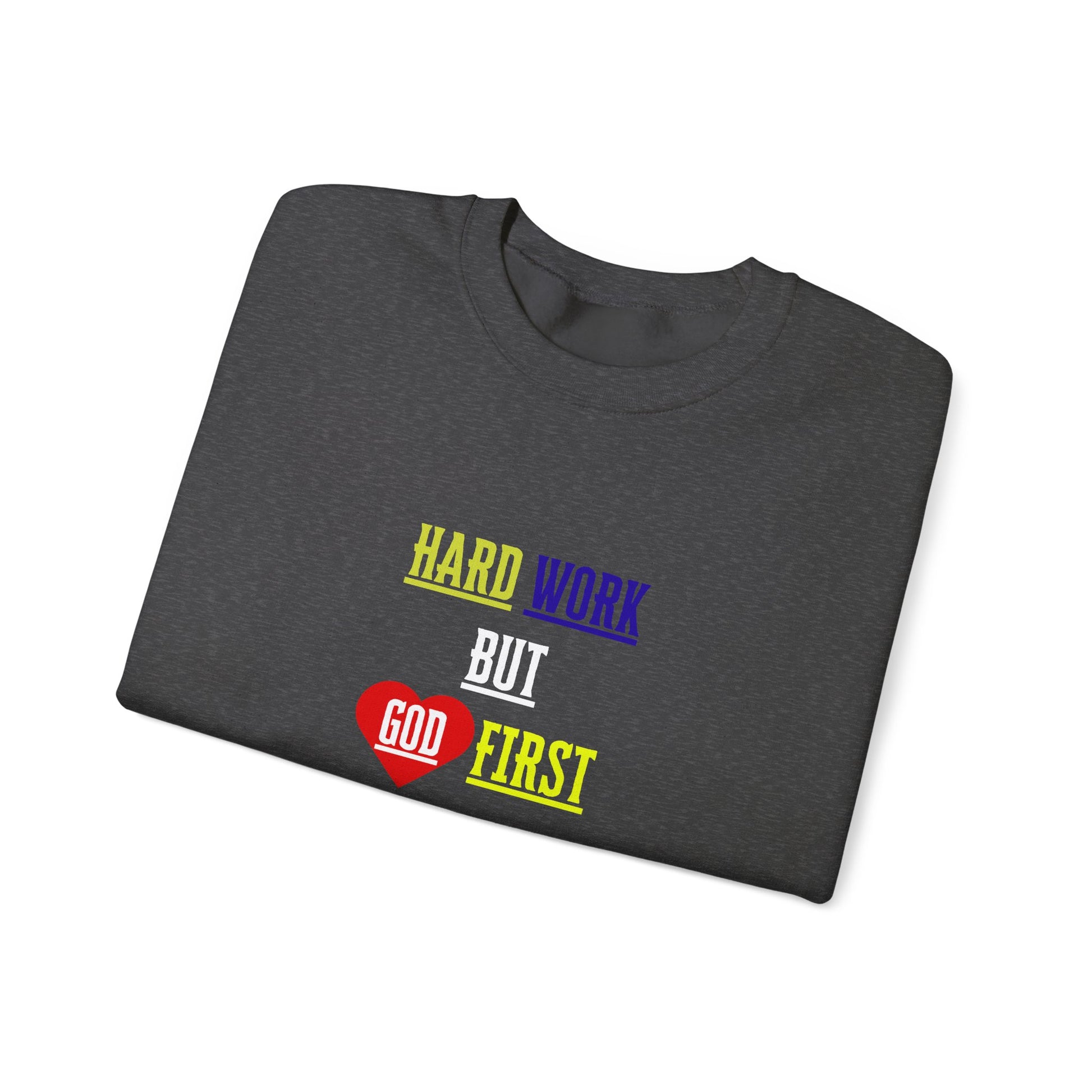 Sweatshirt folded on table with bold Christian design visible