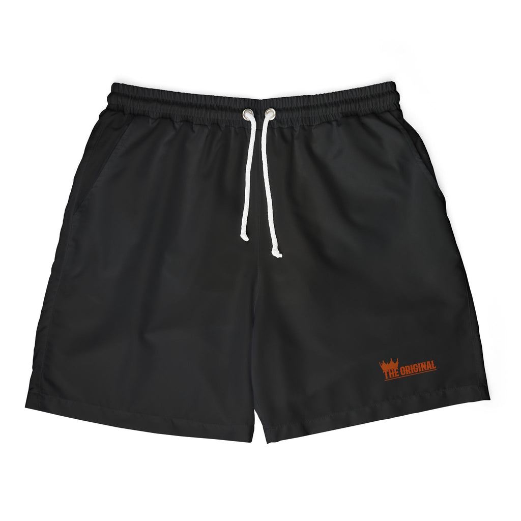 Flat lay of THE ORIGINAL men's swim shorts in black with red The Original branding and elastic waist.