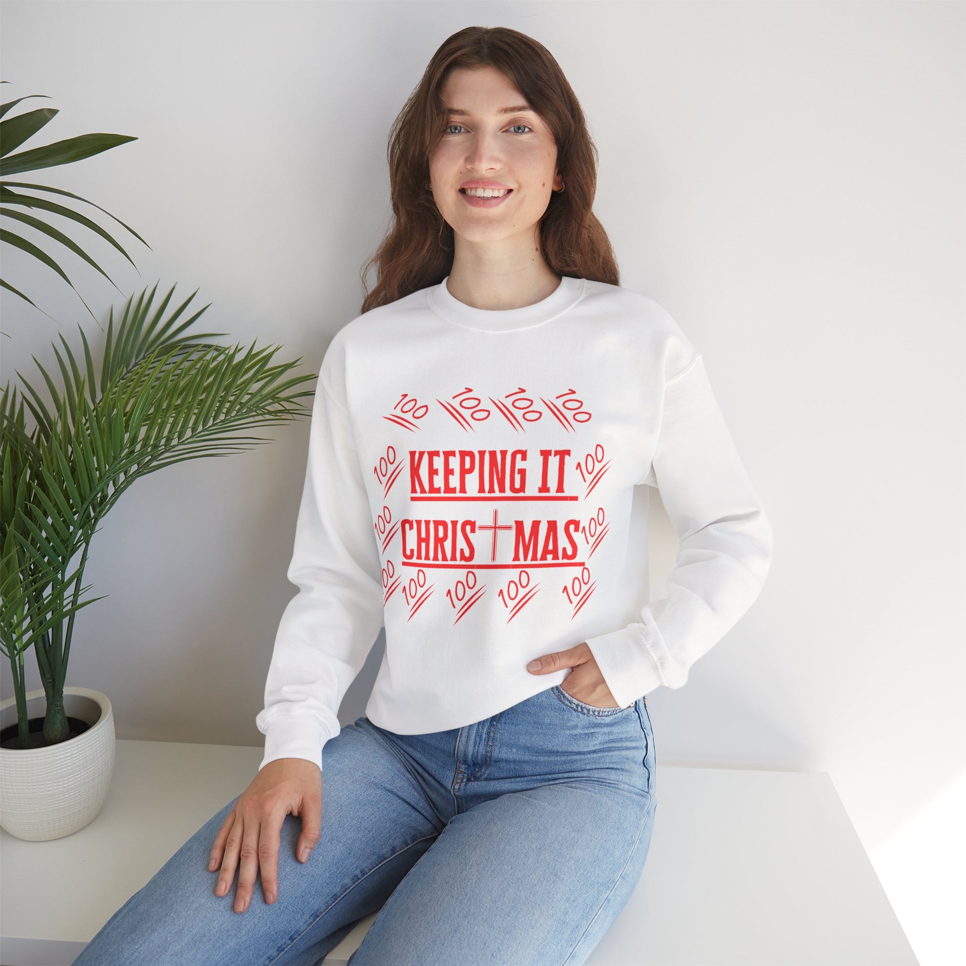 Model wearing crewneck sweatshirt in living room with Christmas imprint from The Original