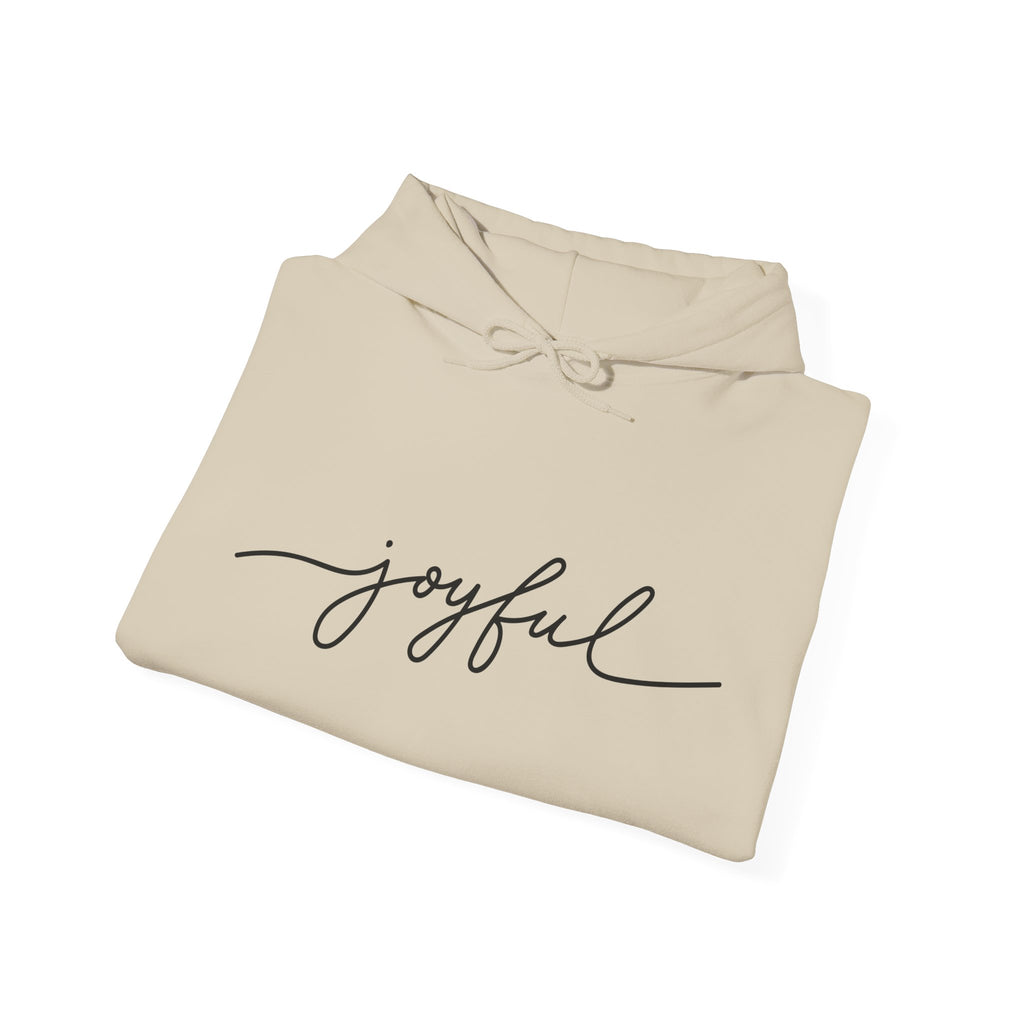 Folded sand color JOYFUL hoodie – faithwear that inspires comfort and joy
