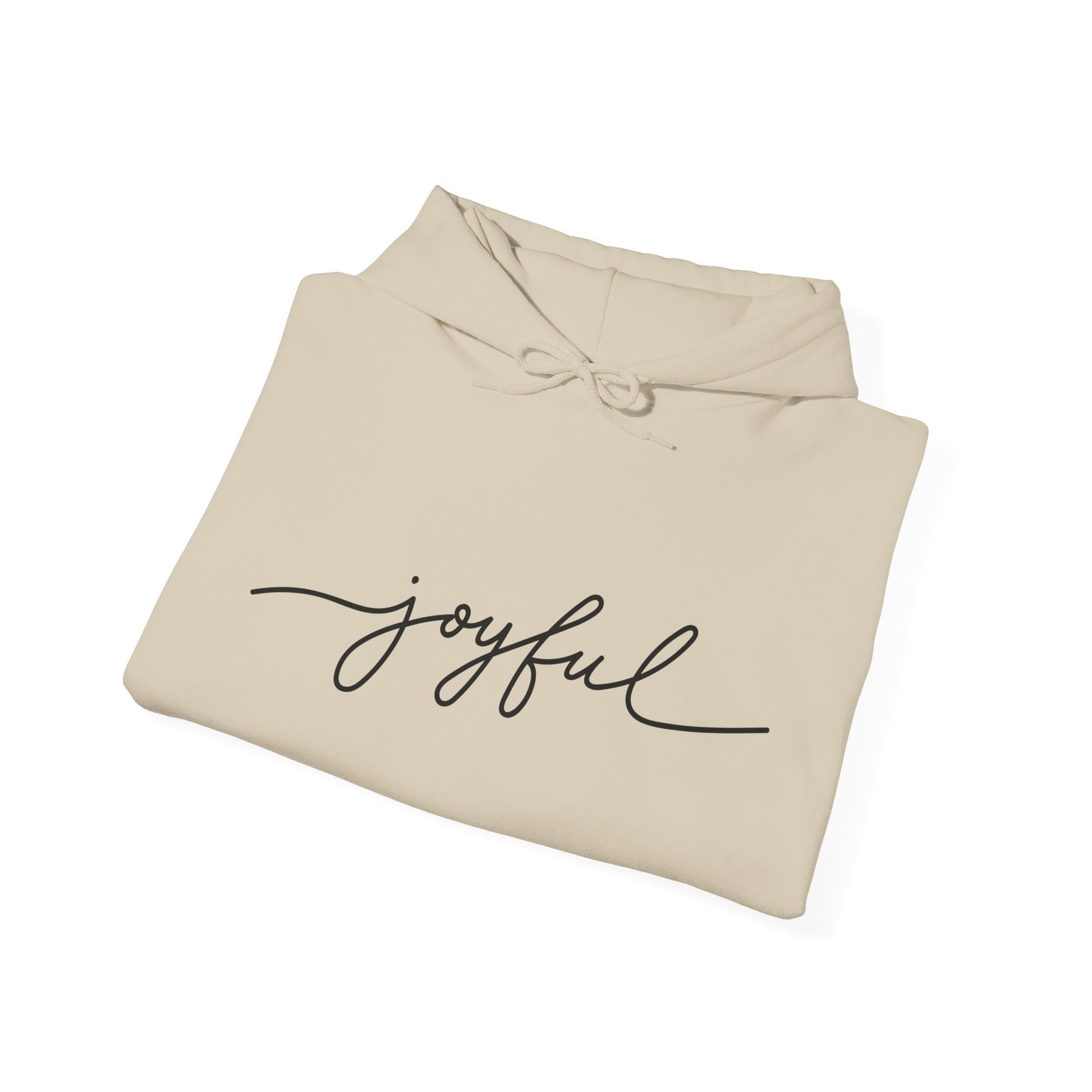 Folded sand color JOYFUL hoodie – faithwear that inspires comfort and joy