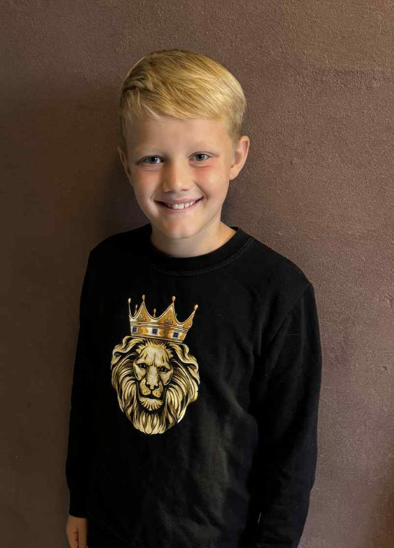 model wearing GOLD LION boys sweatshirt – Christian streetwear for kids