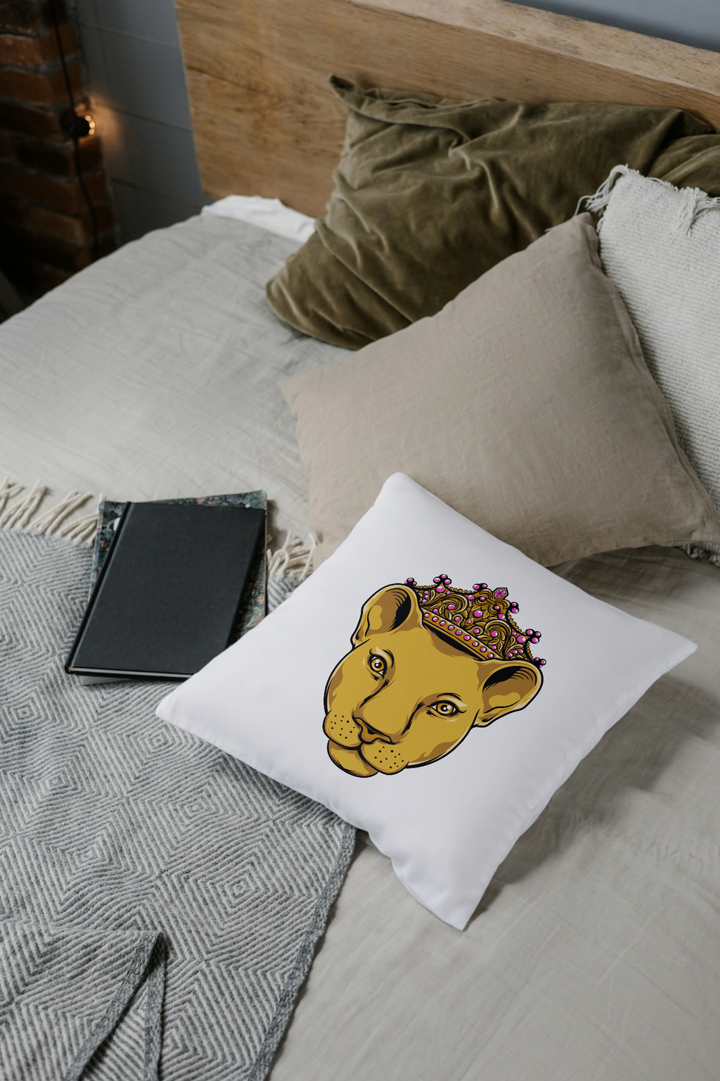 white pillow with LIONESSimprintfrom The Original, casually styled on bed