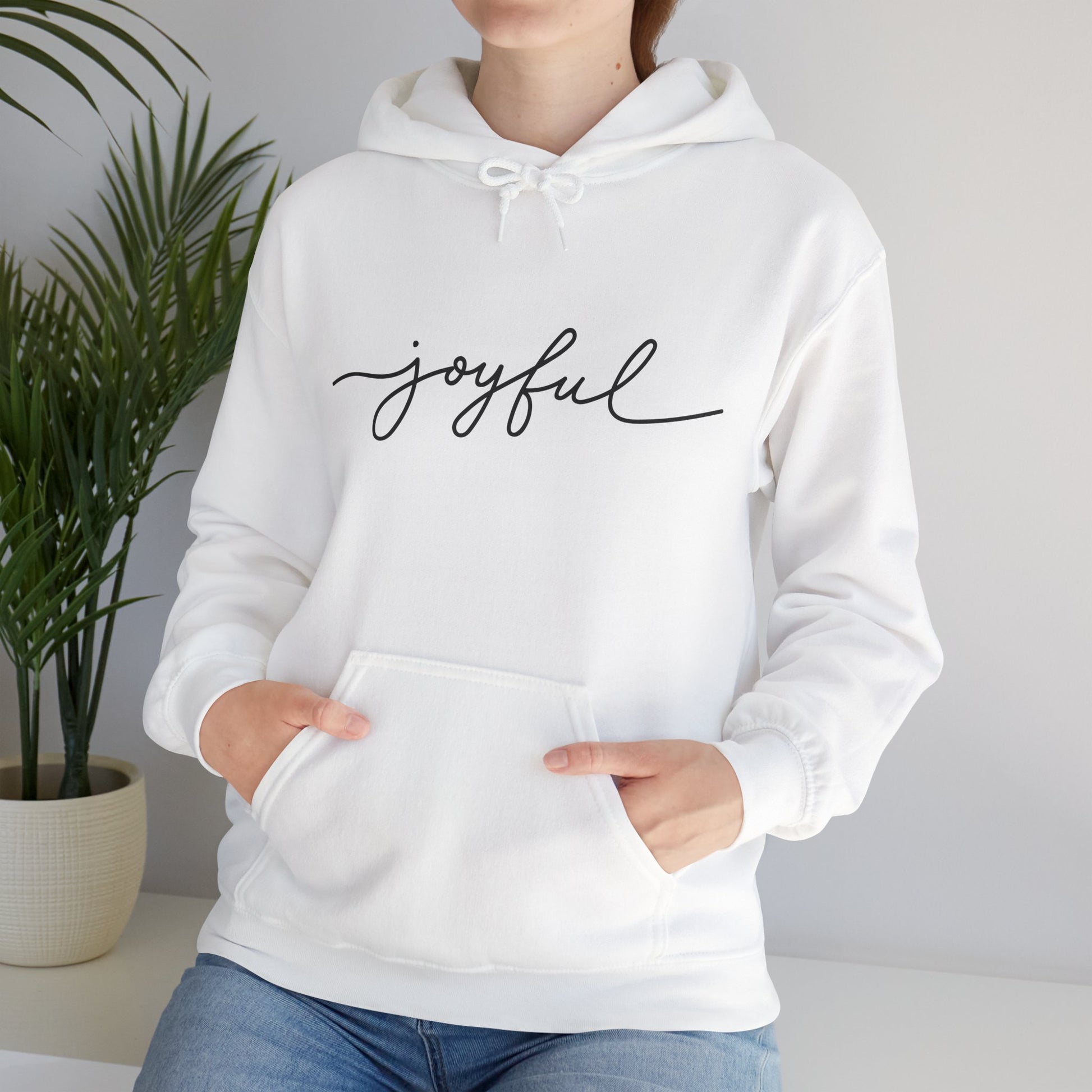 Woman wearing JOYFUL Christian hoodie with kangaroo pocket